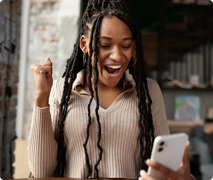 Happy young women job seeker reading an invite to interview email